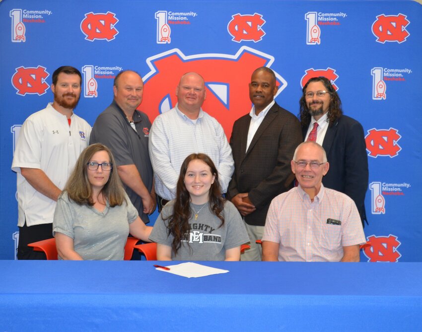 Neshoba Central’s Emely Randolph signed with East Mississippi Community College to further her education and be a member of the EMCC Band. Pictured, from left, are Rebecca Randolph, her mother Emely Randolph, and Daniel Randolph (Back) Assistant Principal Jonathan Walker,  Principal Jason Gentry, Assistant Principal Brent Pouncy Assistant Principal LaShon Horne, and Band Director Daniel Wade.